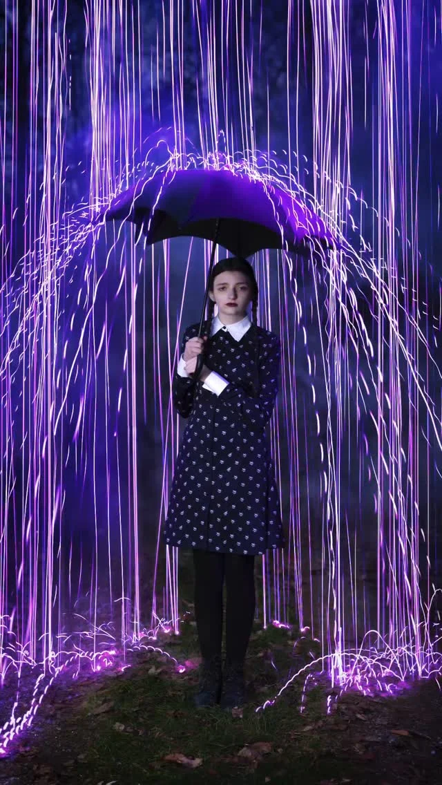 Our daughter wanted to be Wednesday for a photo, so we all got dressed up, grabbed 300 LED purple lights, and 